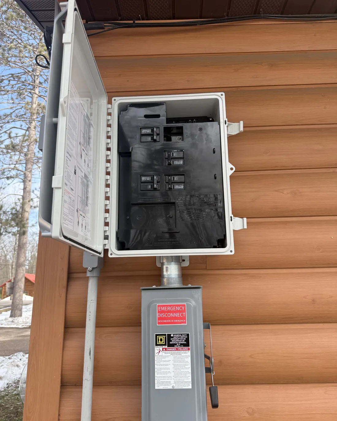 ICT Electric, LLC installed exterior service panel and emergency disconnect on a Northwoods log home